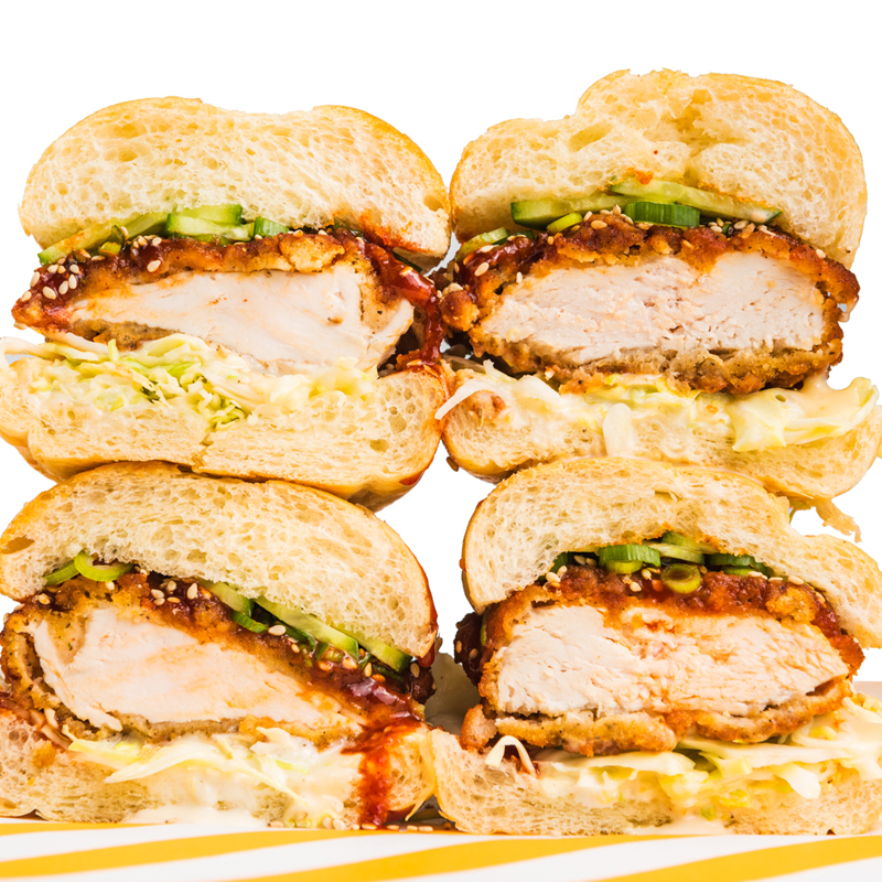 Stack of sliced Starbird Chicken sandwiches