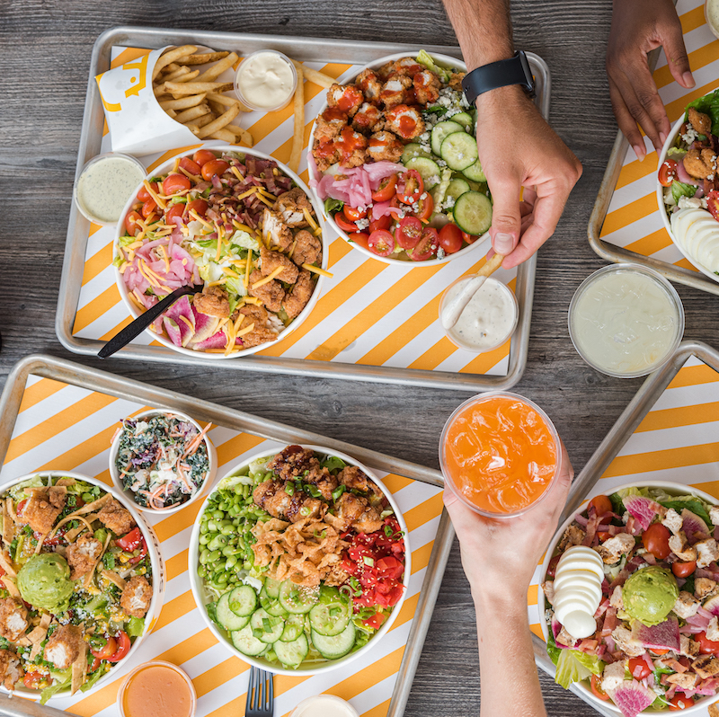 Overhead shot of people eating Starbird Chicken 